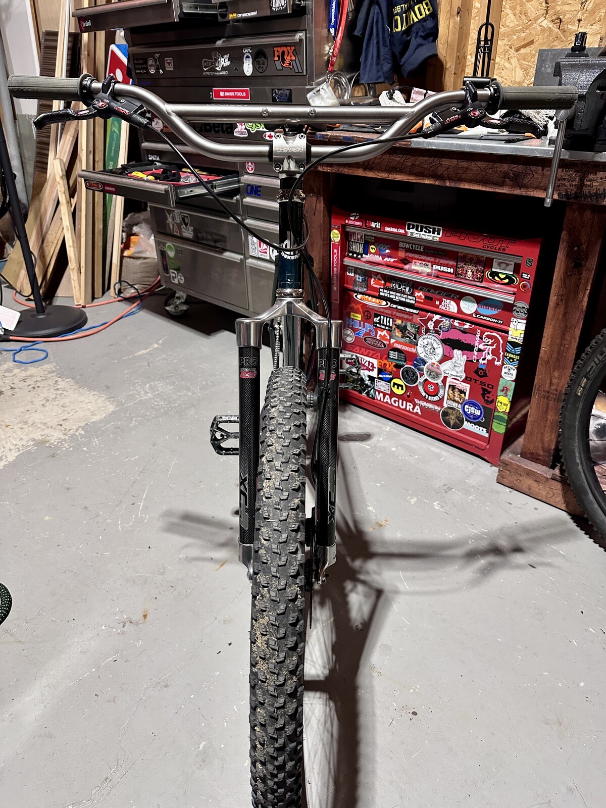 Widefoot USA commision these bars from Oddity Cycles, that have a bottle cage mount on the crossbar. They build a small mount to carry whatever you bolt up. 