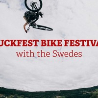 Mountain biker jumping over the photographer.